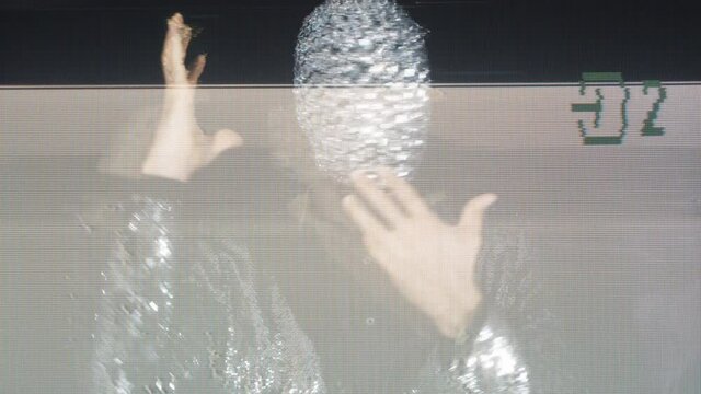 Sparkle mask man miming and moving his head