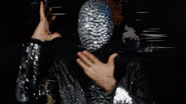 Sparkle mask man miming and moving his head