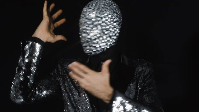 Sparkle mask man miming and moving his head