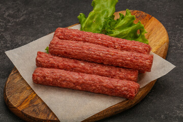 Raw beef sausages with spices