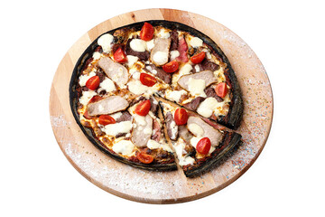 Whole meat Black dough Pizza on wooden plate served with culinary flour and spices, isolated on white background. Dish with cherry tomatoes tomatoes, mozzarella cheese, pork and beef meat slices 
