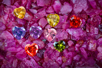 .colorful of diamond heart shaped are on natural garnet gemstone.
