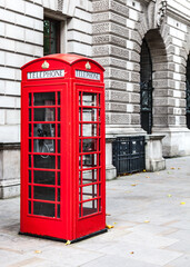 Iconic British red telephone box on the streets of Westminster in the City Of London