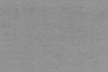 Cardboard black abstract texture close-up. Dark old paper background. Grunge concrete wall. Vintage blank wallpaper.