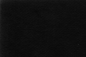 Cardboard black abstract texture close-up. Dark old paper background. Grunge concrete wall. Vintage blank wallpaper.