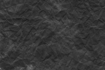 Fototapeta premium Cardboard black abstract texture close-up. Dark old paper background. Grunge concrete wall. Vintage blank wallpaper.