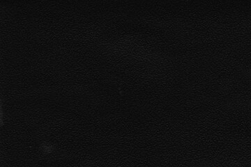 Cardboard black abstract texture close-up. Dark old paper background. Grunge concrete wall. Vintage blank wallpaper.