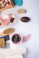 natural   spa set with salt, healing mud and soap on white  background. flay lay