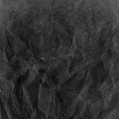 Cardboard black abstract texture close-up. Dark old paper background. Grunge concrete wall. Vintage blank wallpaper.