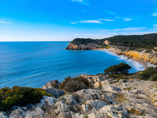 Fototapeta na wymiar Beautiful Spanish rocky beach. Sitges, Dead Man's beach.