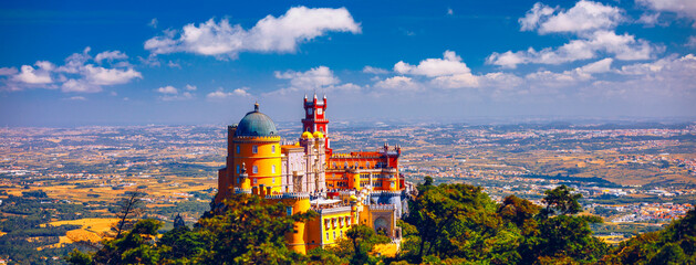 Palace of Pena in Sintra. Lisbon, Portugal. Travel Europe, holidays in Portugal. Panoramic View Of Pena Palace, Sintra, Portugal. Pena National Palace, Sintra, Portugal. - obrazy, fototapety, plakaty
