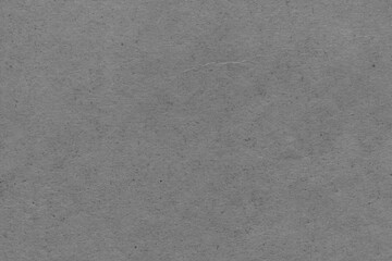 Cardboard black abstract texture close-up. Dark old paper background. Grunge concrete wall. Vintage blank wallpaper.