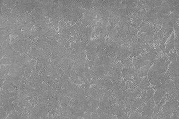 Cardboard black abstract texture close-up. Dark old paper background. Grunge concrete wall. Vintage blank wallpaper.