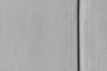 Fototapeta premium Cardboard black abstract texture close-up. Dark old paper background. Grunge concrete wall. Vintage blank wallpaper.