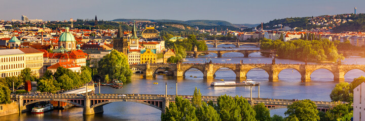 Scenic view of the Old Town pier architecture and Charles Bridge over Vltava river in Prague, Czech Republic. Prague iconic Charles Bridge (Karluv Most) and Old Town Bridge Tower at sunset, Czechia.