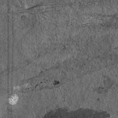 Cardboard black abstract texture close-up. Dark old paper background. Grunge concrete wall. Vintage blank wallpaper.