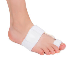 Female foot with bunion corrector of a big toe. Bunion relief protector. 
