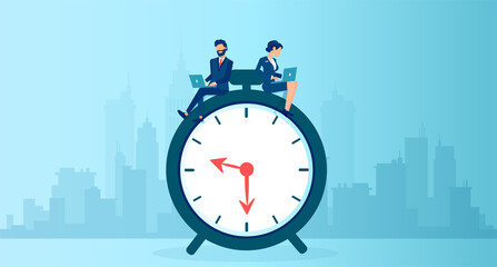 Vector of a business man and businesswoman using  laptop sitting on a clock working long hours