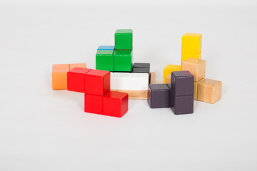 Obraz premium Colorful wooden brain teaser. Building blocks isolated on white background