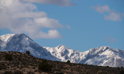 Snowy mountains above the dry desert wilderness, Southern Utah