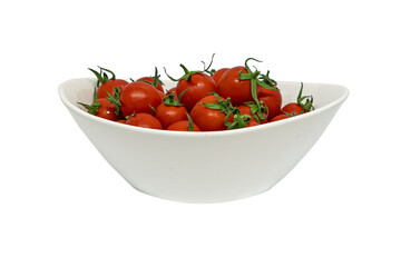 fresh organic cherry tomatoes with green leaves in plate isolated on white