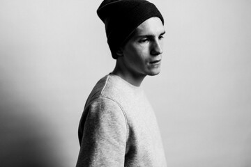 black white portrait of a teenage guy in a hat