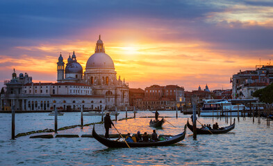 Grand Canal with gondolas in Venice, Italy. Sunset view of Venice Grand Canal. Architecture and landmarks of Venice. Venice postcard