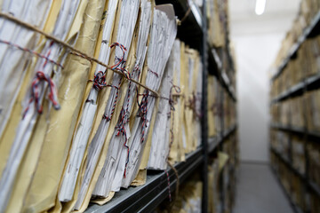 Archive of old papers. Old dusty stack of papers, files and documents. Selective focus