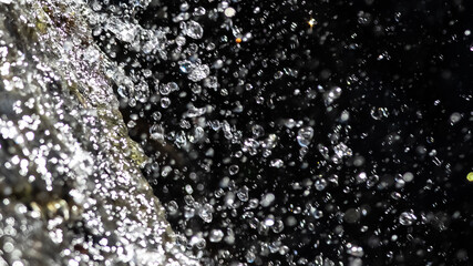Nature Abstract: Splashing Water Streaming Down from The Rocks Above