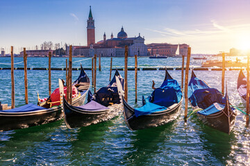 Gondolas moored near San Marco square across from San Giorgio Maggiore island in Venice, Italy....