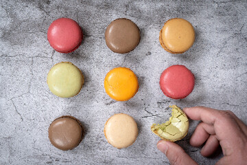 Traditional french colorful macarons in a rows