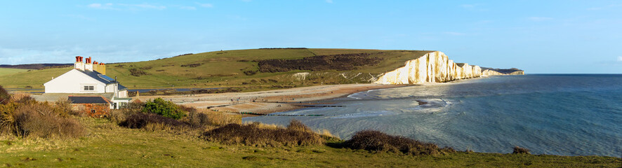 Looking eastwards towards the Seven Sisters Chalk cliffs and the mouth of the Cuckemere river in Sussex, UK