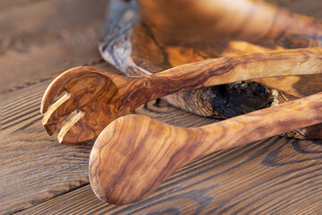 Olive dishes, wooden dishes. Eco-friendly choice and nature friendly. The concept of a world without plastic and a clean planet. Free space for text.