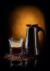 Geyser coffee maker and cup of black coffee