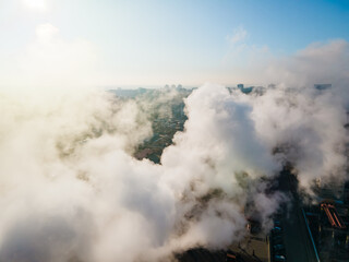 Aerial view of smoke emission from smoke stack. Industrial factory pollution, smokestack exhaust...