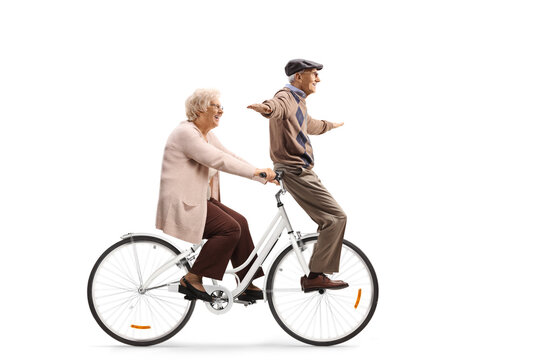 Elderly couple riding on a bicycle