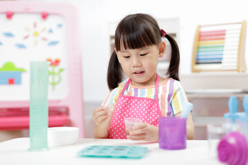 young  girl making sweet gems for homeschooling i