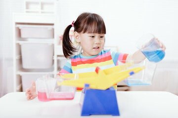 young girl play balance toy for homeschooling