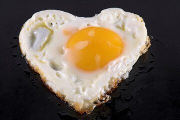 Fried eggs in the shape of a heart.