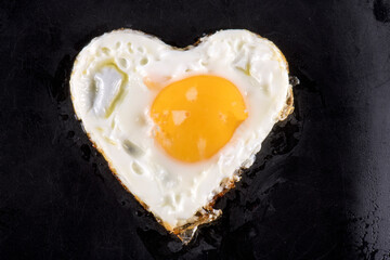 Fried eggs in the shape of a heart.