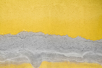 Old painted yellow gray concrete background. trendy colors 2021. Texture for design.