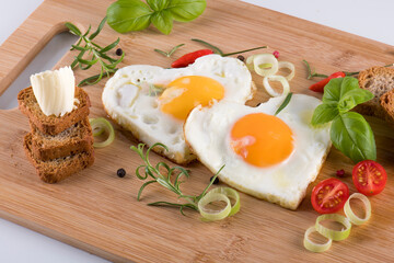 Fried eggs in the shape of a heart.