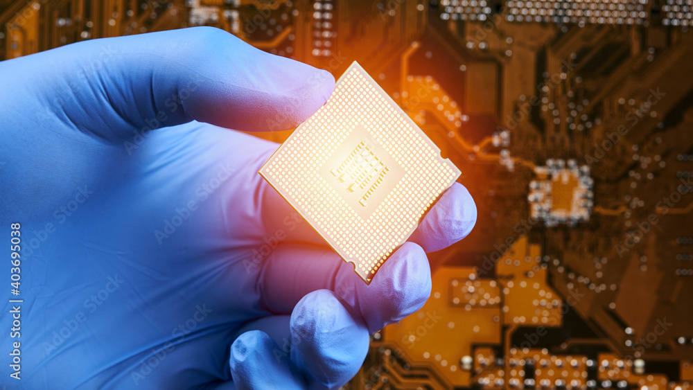 Aufkleber engineer person holds cpu central processor unit over circuit board background. hardware research co