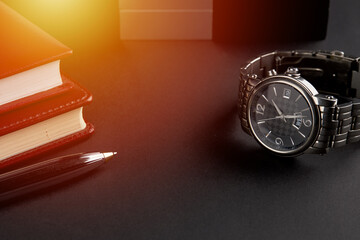 business time management concept. male luxury watch at workplace