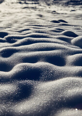 Untouched snow dunes with great shadows