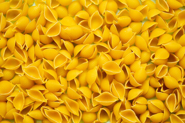 spread the pasta on a flat surface. background consisting of pasta