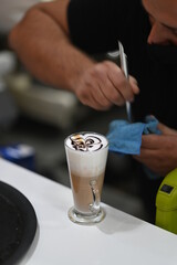 Obraz na płótnie Canvas bartender pouring coffee