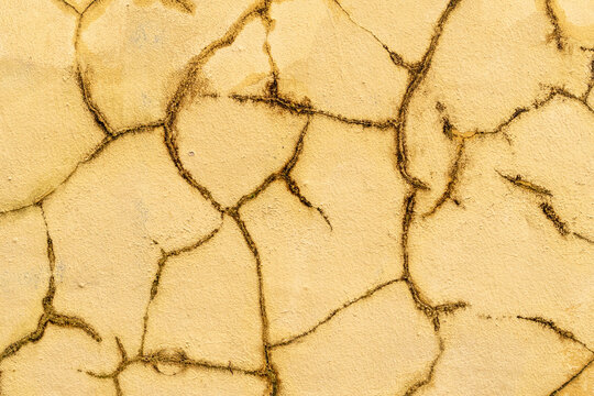 Old Cracked Yellow Wall Background