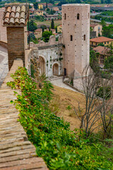 Narrow alleys and ancient medieval buildings in the picturesque town of Spello, in Umbria (Italy)