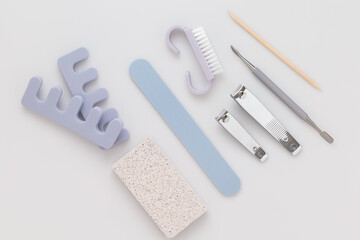 a set of cosmetic tools for manicure and pedicure on a white background.